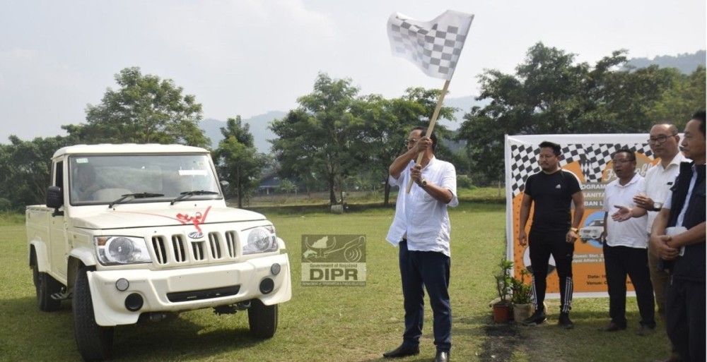 Advisor Zhaleo Rio, IAS (Retd) flags off the sanitation vehicles to the Urban Local Bodies at Chümoukedima Public Ground on October 16. (DIPR Photo)